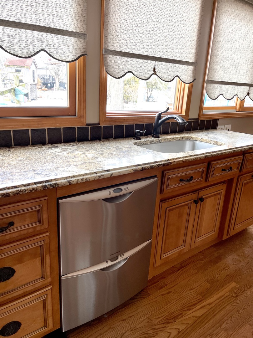 562 Boardman Circle Bolingbrook, IL 60440 - Photo 3 of 14 a view of granite countertop cabinets and window
