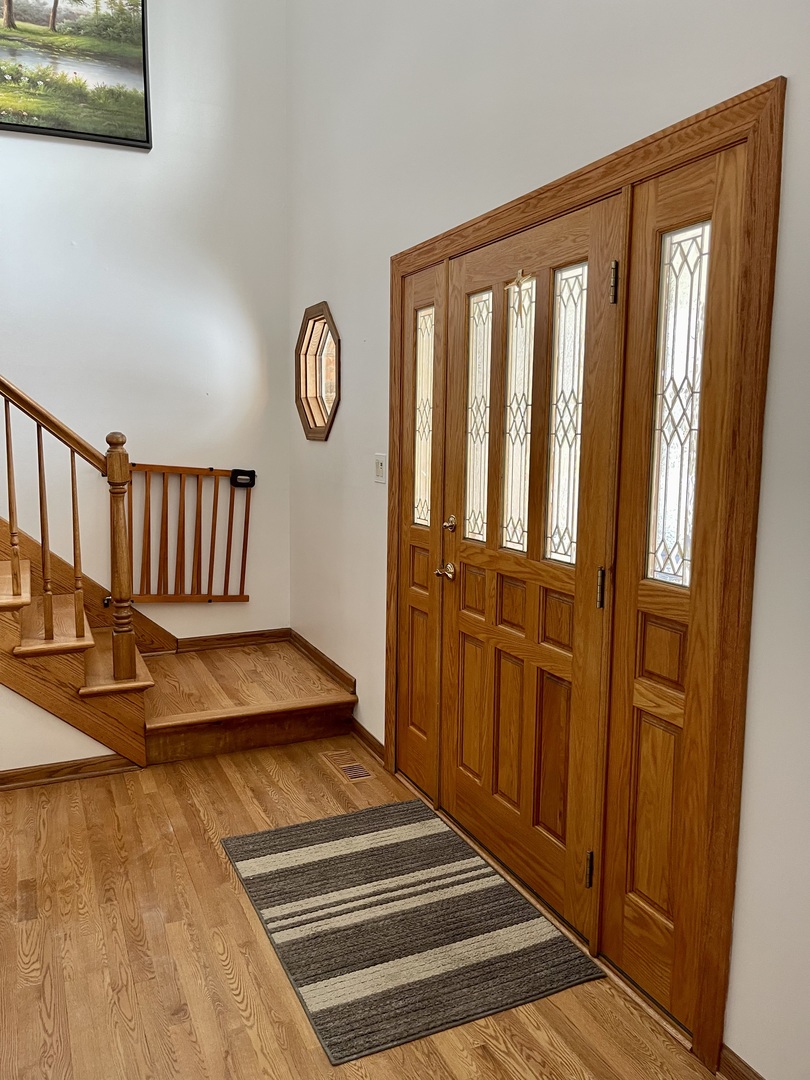 562 Boardman Circle Bolingbrook, IL 60440 - Photo 5 of 14 a view of entryway with wooden floor