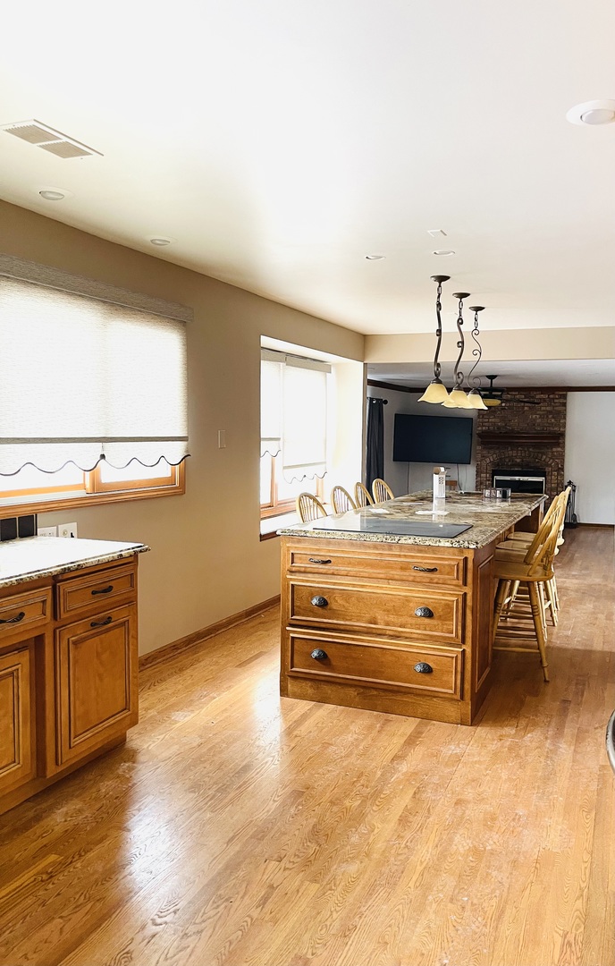 562 Boardman Circle Bolingbrook, IL 60440 - Photo 6 of 14 a room with furniture and flat screen tv