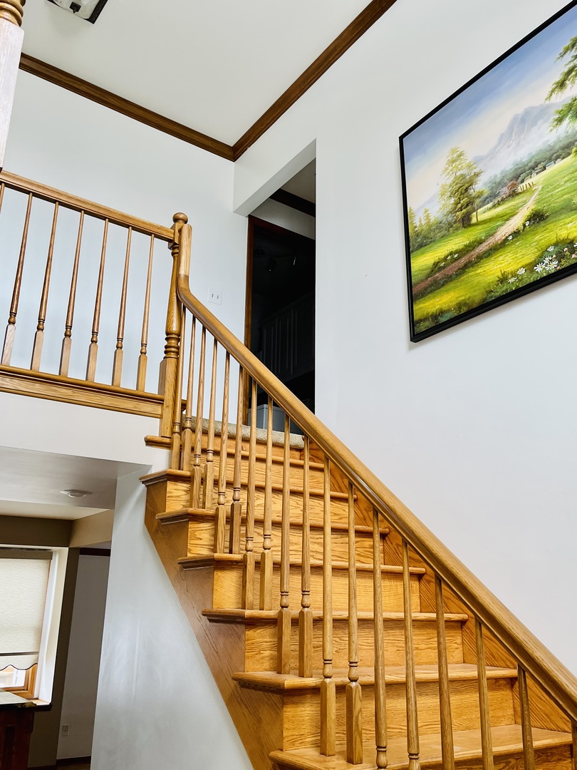 562 Boardman Circle Bolingbrook, IL 60440 - Photo 7 of 14 a view of staircase with large window