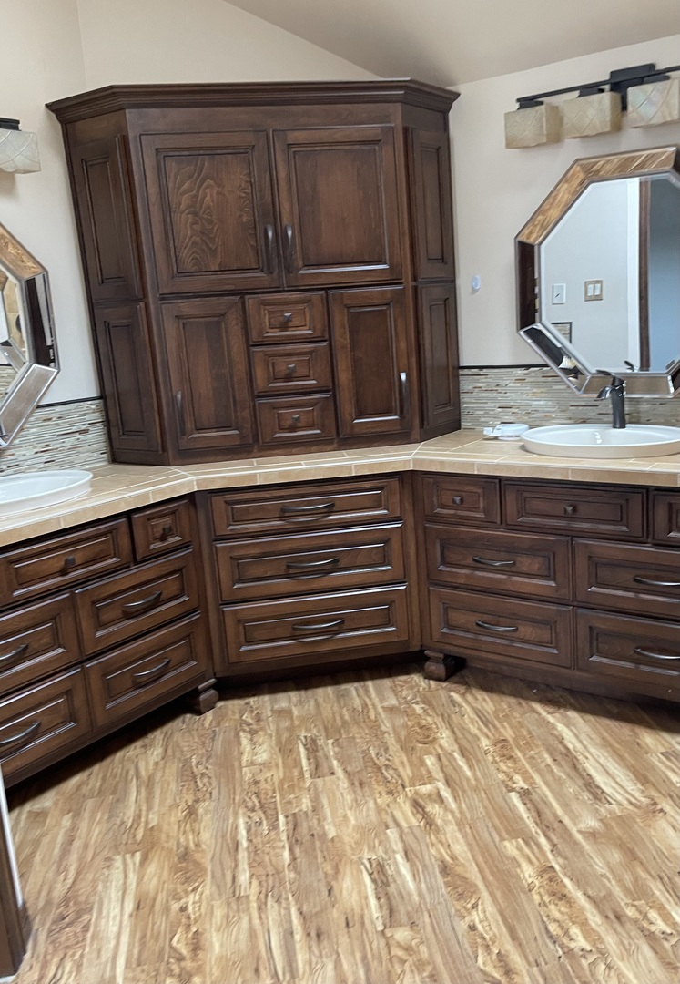 562 Boardman Circle Bolingbrook, IL 60440 - Photo 9 of 14 a bathroom with a dresser and a double vanity sink