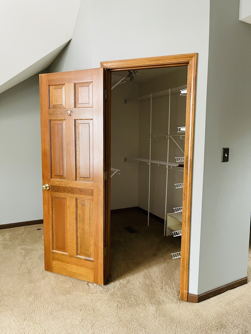 562 Boardman Circle Bolingbrook, IL 60440 - Photo 10 of 14 an empty room with wooden door