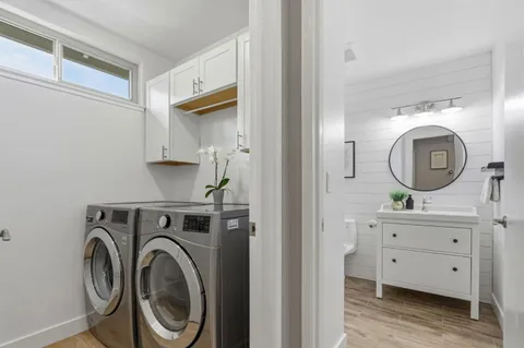 a view of a hallway with washer and dryer
