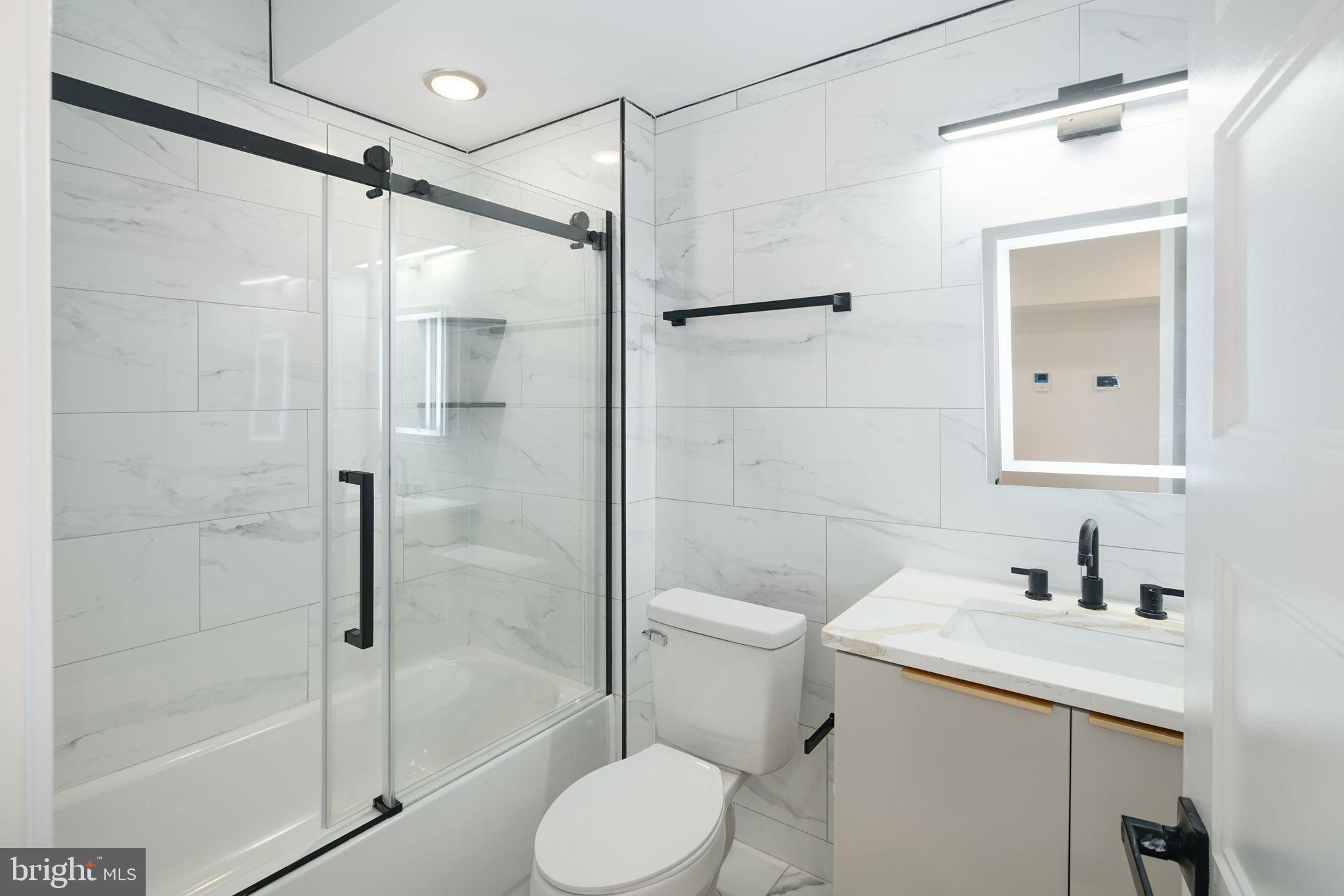2000 North Front Street, Unit 21 Philadelphia, PA 19122 - Photo 5 of 20 a bathroom with a shower a toilet and sink