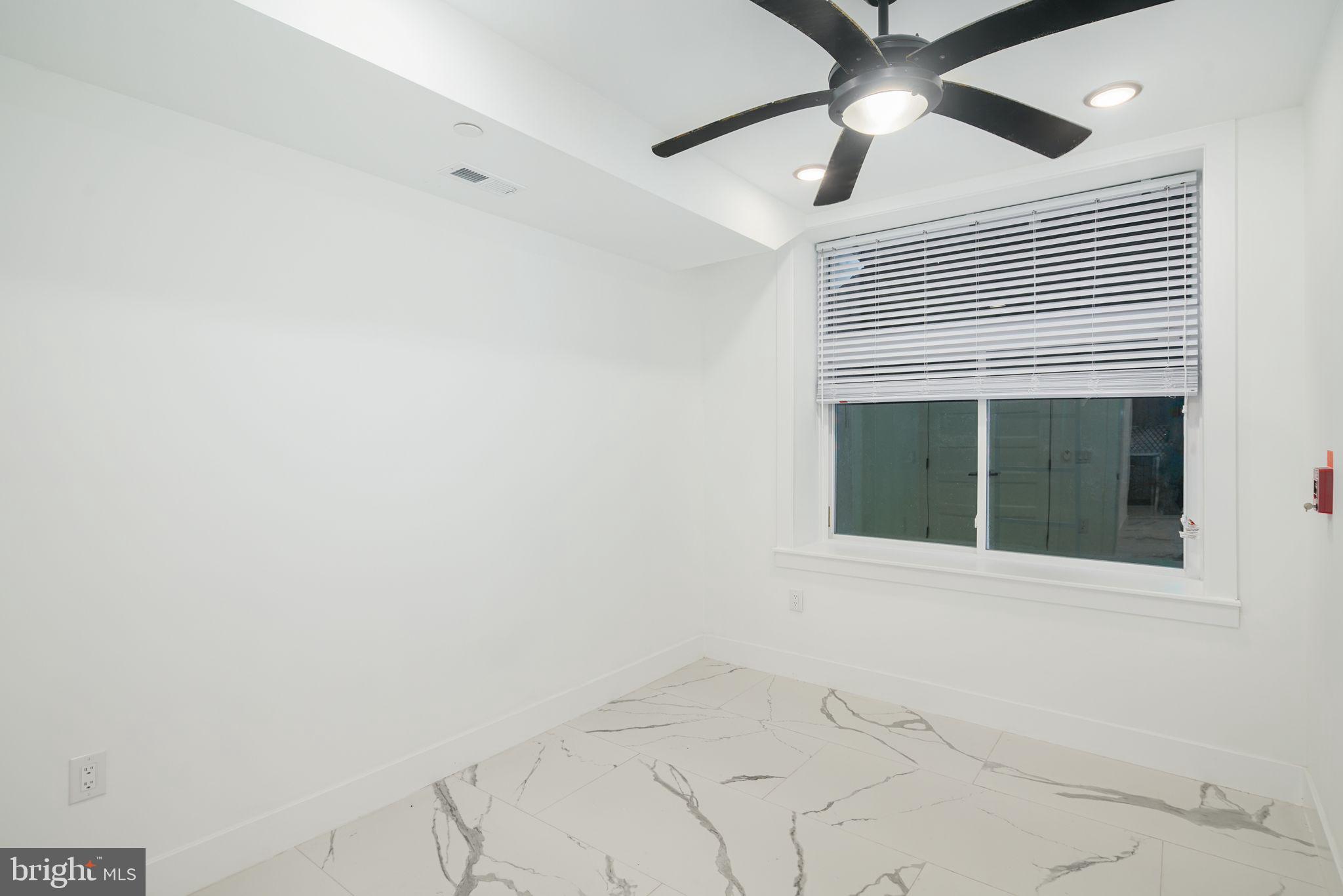 2000 North Front Street, Unit 21 Philadelphia, PA 19122 - Photo 6 of 20 a view of an empty room with a window