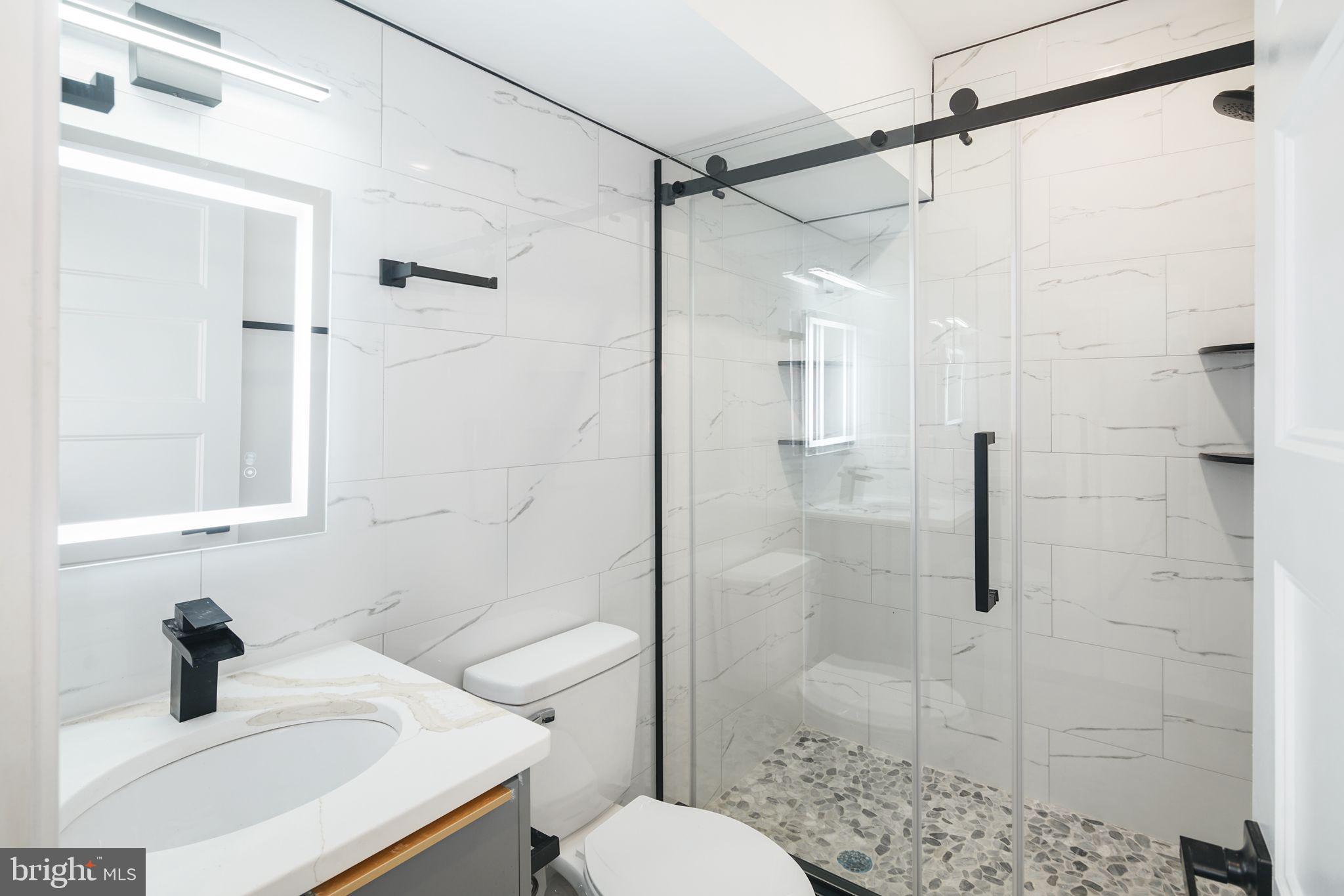 2000 North Front Street, Unit 21 Philadelphia, PA 19122 - Photo 8 of 20 a bathroom with a sink toilet and shower