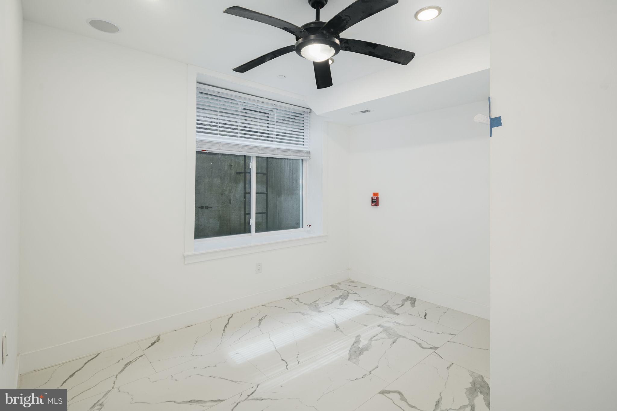2000 North Front Street, Unit 21 Philadelphia, PA 19122 - Photo 9 of 20 a view of a livingroom with a ceiling fan and window