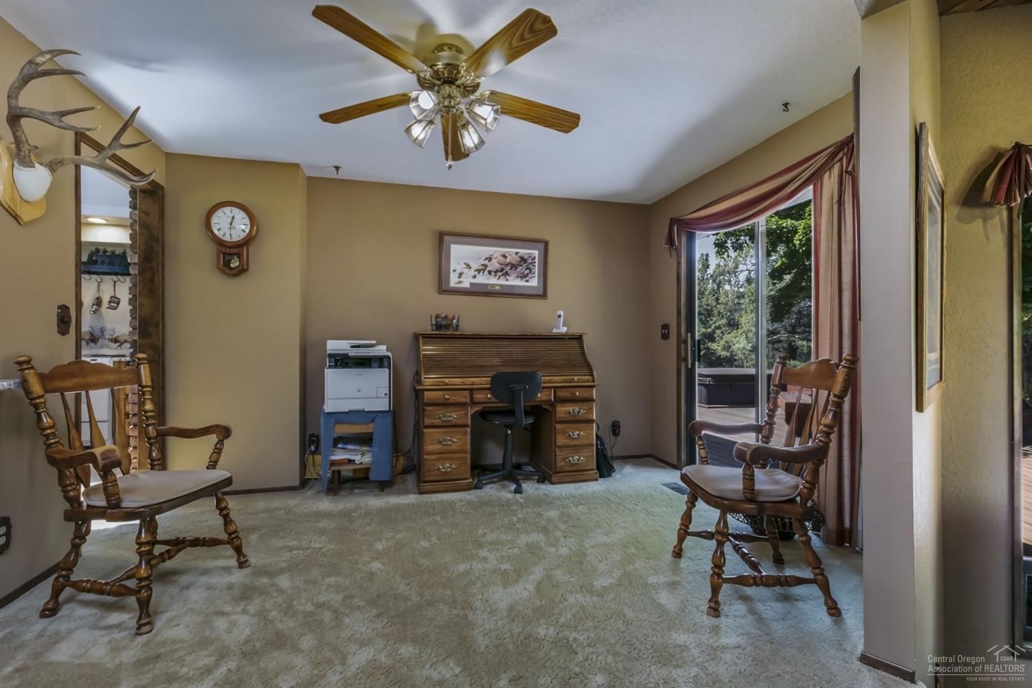 19435 Dayton Road Bend, OR 97703 - Photo 7 of 25 a view of a livingroom with furniture and a ceiling fan
