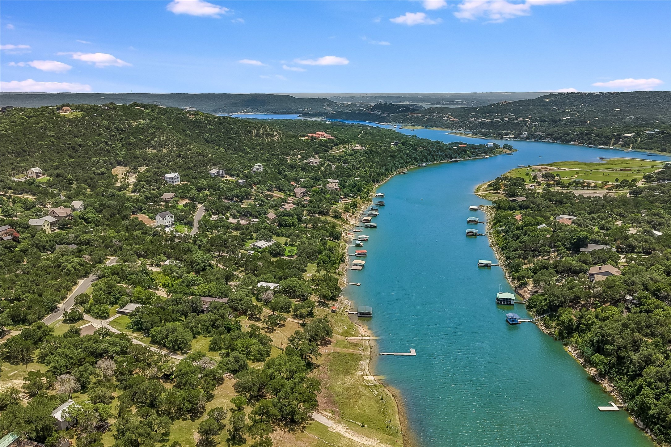 11104 Beach Road Leander, TX 78641 - Photo 4 of 15 Discover picturesque lakefront living with exclusive boat docks and verdant surroundings.