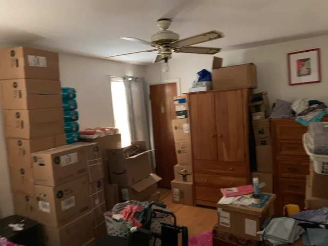 a living room with hard wood flooring