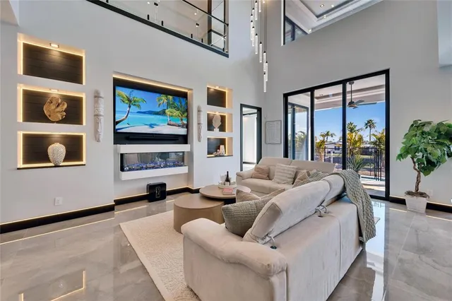 a kitchen with stainless steel appliances granite countertop a sink and a refrigerator