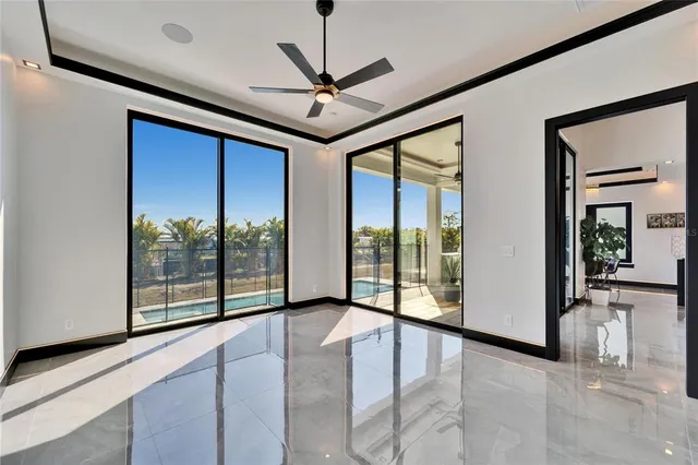 a view of a floor to ceiling window and potted plants