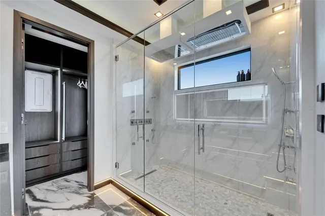 a front view of a house with a yard covered with snow