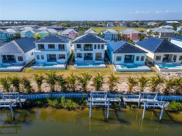 a living room with furniture fireplace and a large window