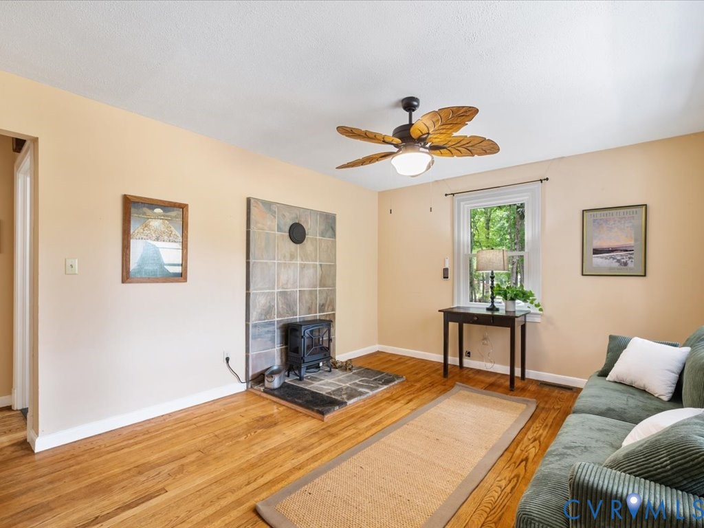 7068 Porters Road Esmont, VA 22937 - Photo 14 of 37 a bedroom with a bed and a chandelier