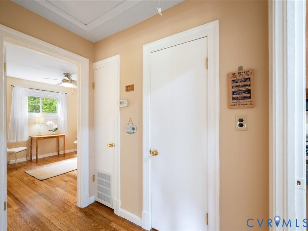 7068 Porters Road Esmont, VA 22937 - Photo 17 of 37 a view of a hallway with wooden floor and a bathroom