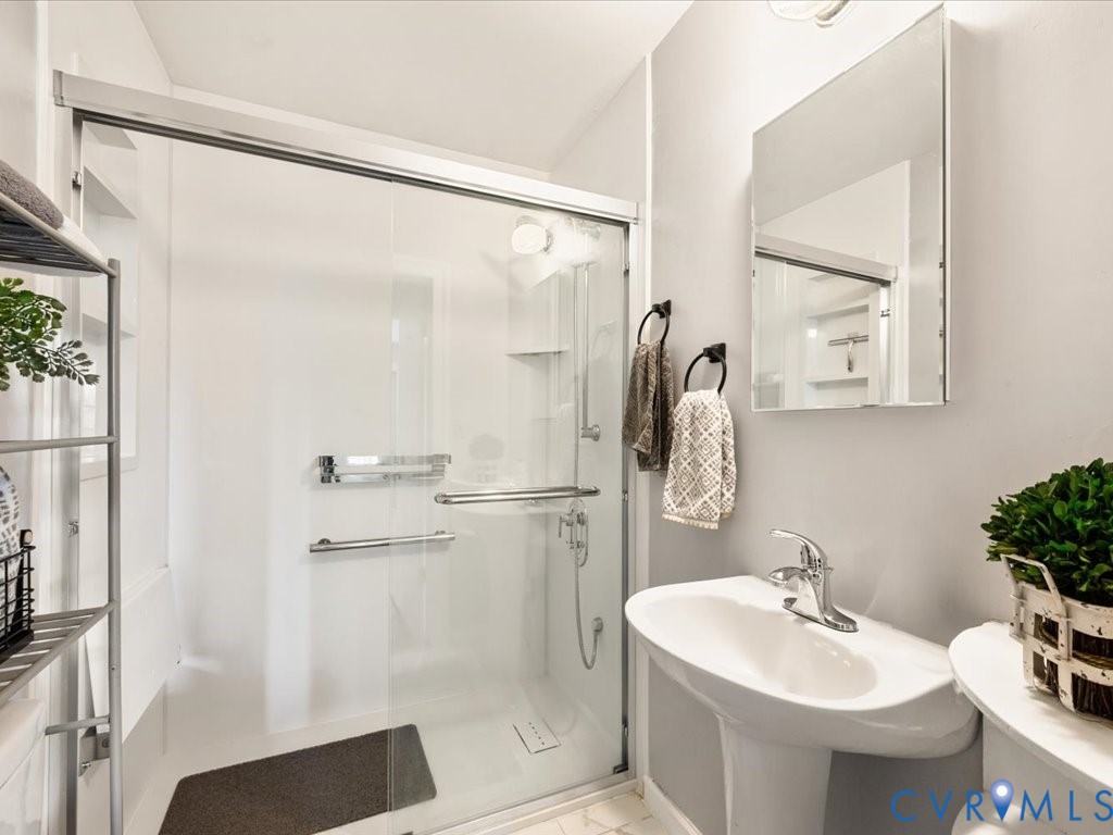 7068 Porters Road Esmont, VA 22937 - Photo 23 of 37 a bathroom with a sink toilet and shower