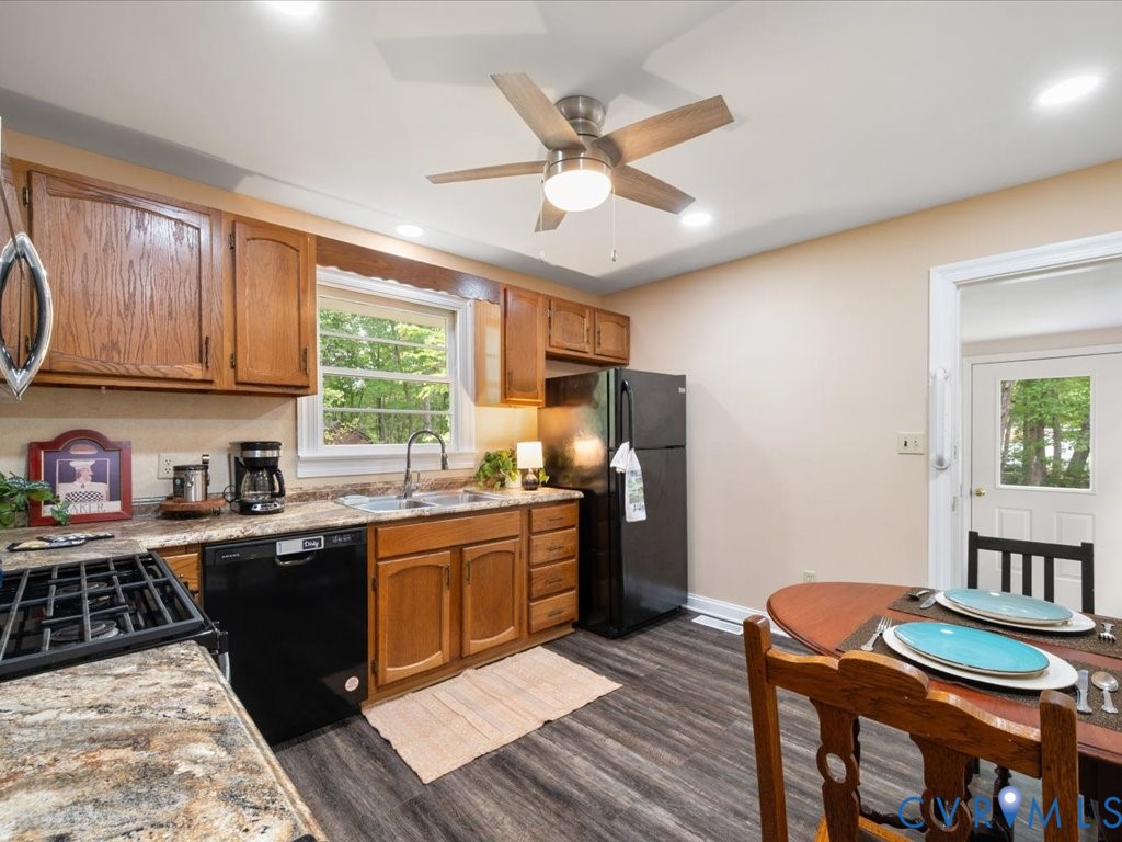 7068 Porters Road Esmont, VA 22937 - Photo 26 of 37 a kitchen with granite countertop a sink appliances cabinets and furniture
