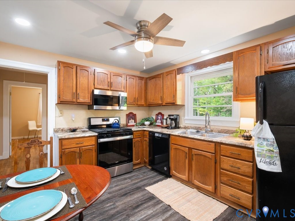 7068 Porters Road Esmont, VA 22937 - Photo 27 of 37 a kitchen with a sink stove and refrigerator