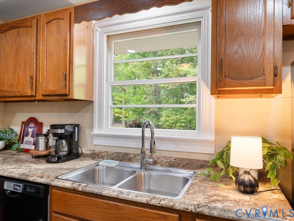 7068 Porters Road Esmont, VA 22937 - Photo 29 of 37 a kitchen with granite countertop a sink and a window
