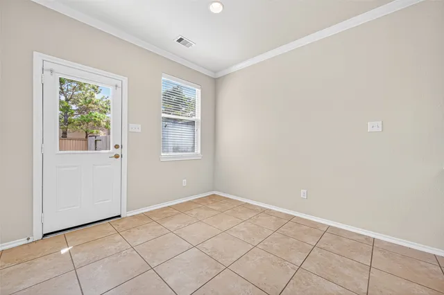 a view of an empty room with a window
