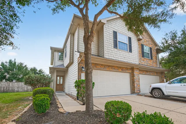 a view of a car parked in front of a house