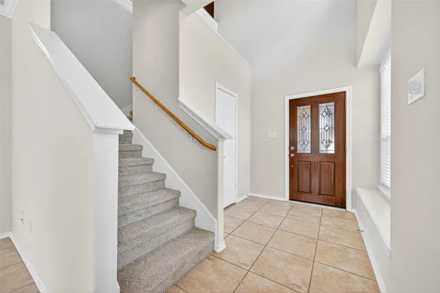 a view of entryway with stairs and a hallway