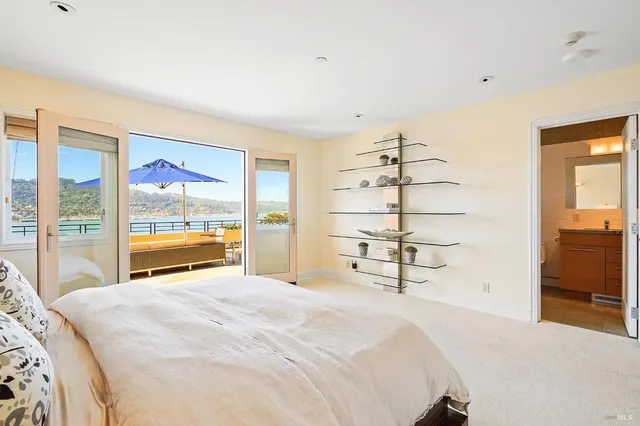 a view of a deck with a big yard and potted plants