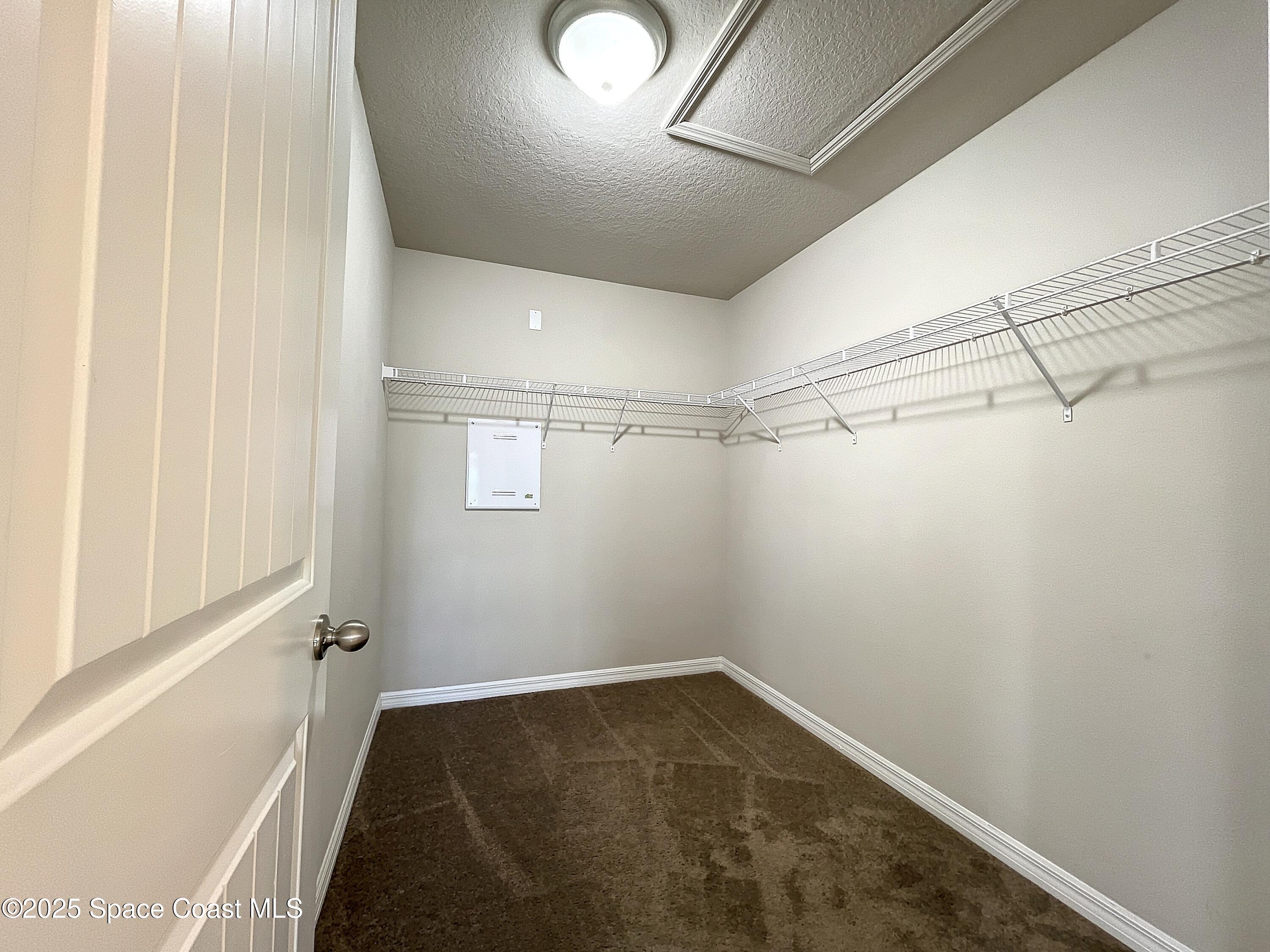 3737 Chambers Lane, Unit 3 Cocoa, FL 32926 - Photo 17 of 25 a view of a room with racks on the wall