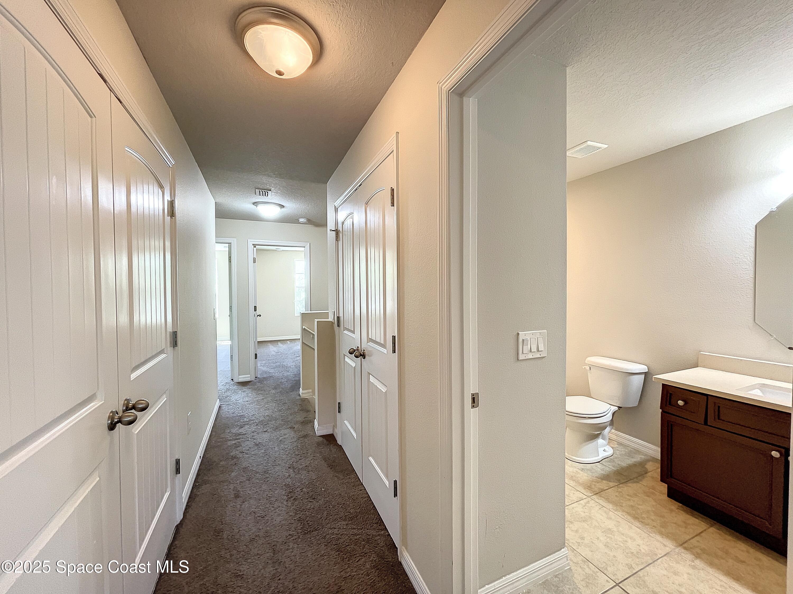 3737 Chambers Lane, Unit 3 Cocoa, FL 32926 - Photo 23 of 25 a bathroom with a double vanity sink toilet and shower