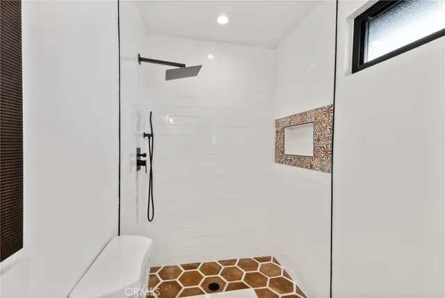 a bathroom with a bathtub and a shower