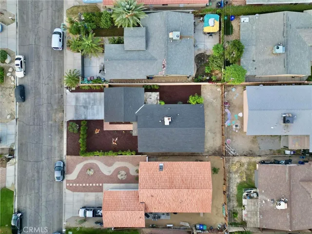 an aerial view of a house with a yard