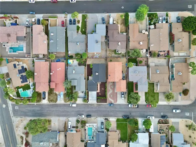 an aerial view of residential houses with outdoor space
