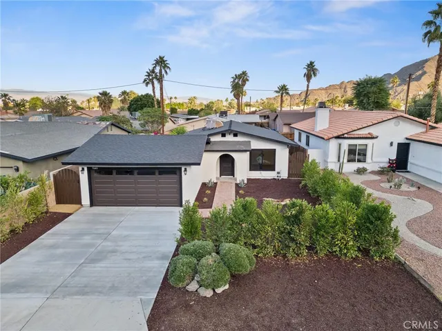 front view of a house with a garden