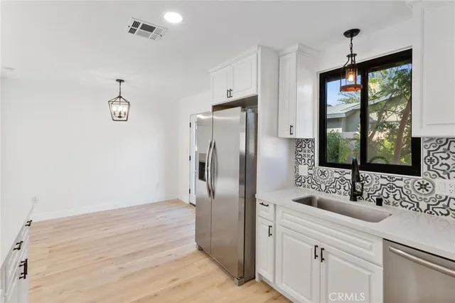a bathroom with a double vanity sink and mirror