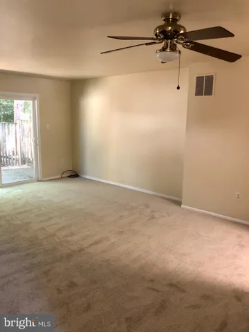 a view of staircase with white walls