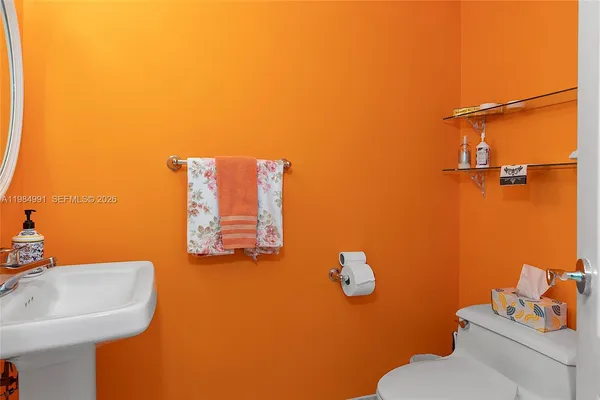 a hallway with a dresser and mirror