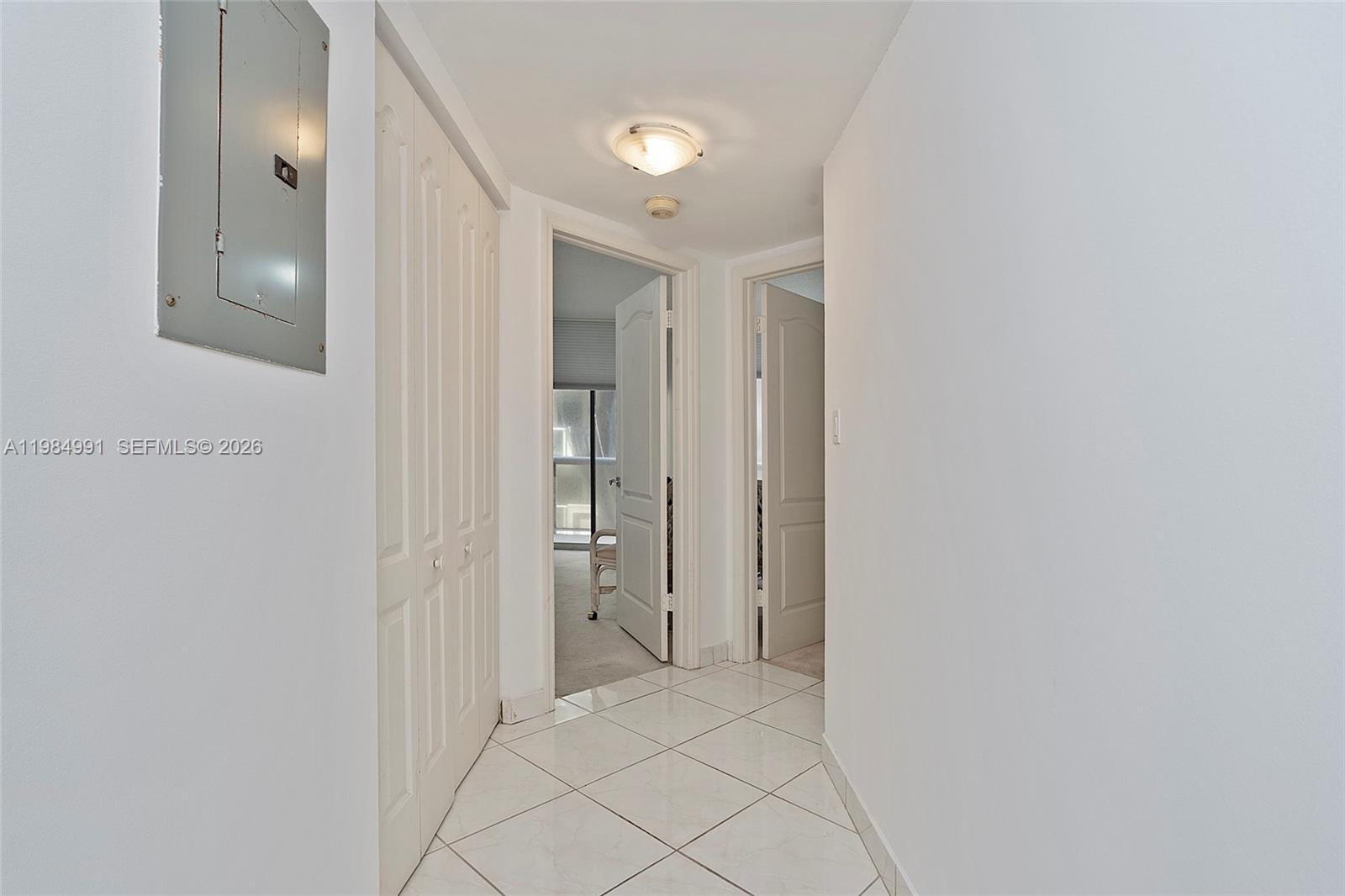 9455 Collins Avenue, Unit 409 Surfside, FL 33154 - Photo 20 of 46 a view of a hallway