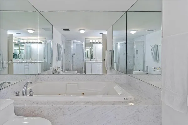 a large bed sitting in a bedroom and closet