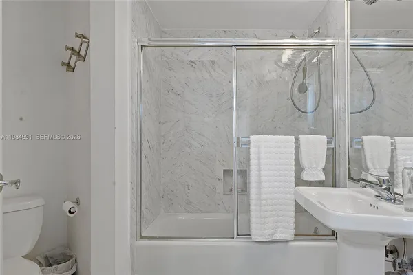 a view of a pathway with a wrought fence