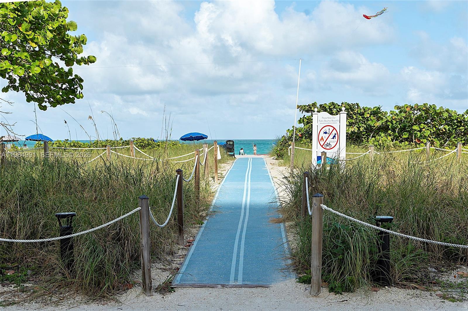9455 Collins Avenue, Unit 409 Surfside, FL 33154 - Photo 29 of 46 a view of a pathway with a wrought fence