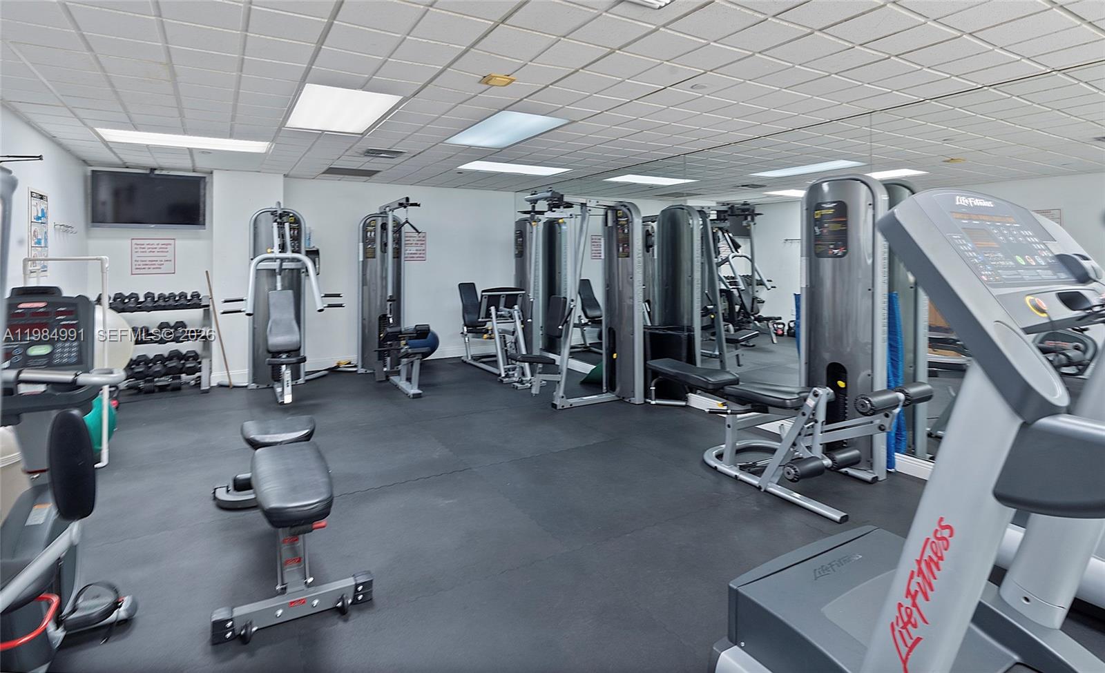 9455 Collins Avenue, Unit 409 Surfside, FL 33154 - Photo 34 of 46 a room with gym equipment