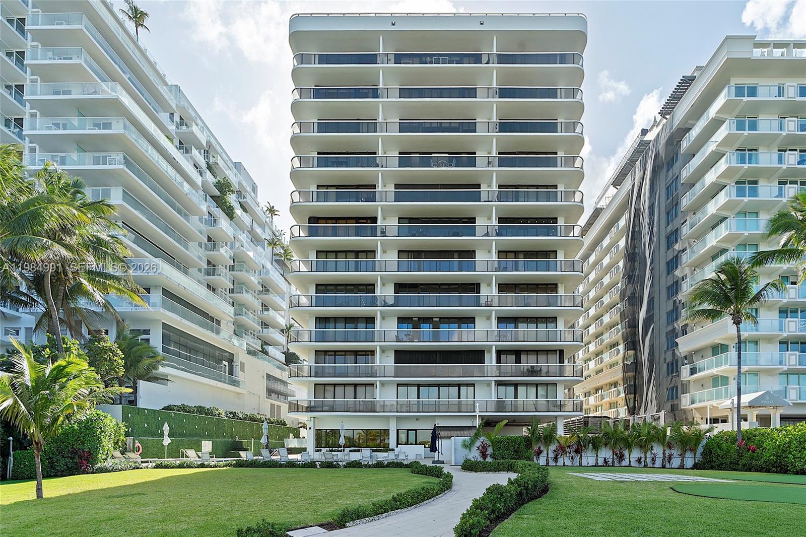 9455 Collins Avenue, Unit 409 Surfside, FL 33154 - Photo 36 of 46 a view of a building with a yard