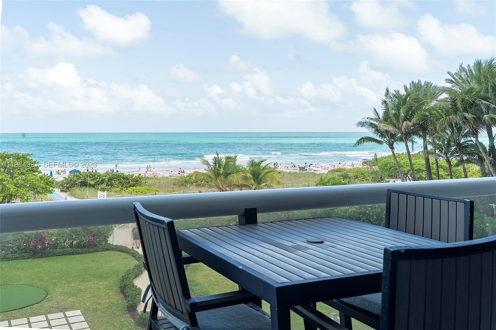 9455 Collins Avenue, Unit 409 Surfside, FL 33154 - Photo 39 of 46 a view of an outdoor sitting area with furniture
