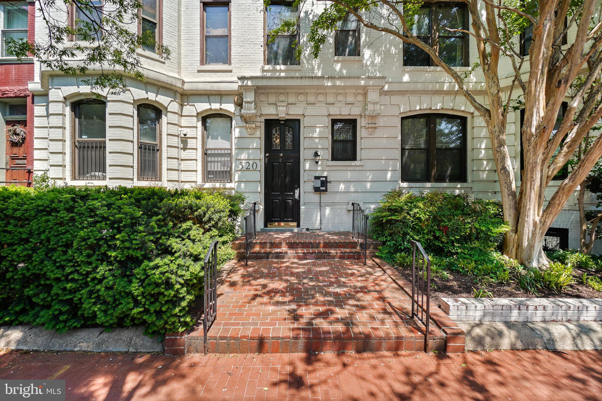 520 E Street Northeast, Unit 105 Washington, DC 20002 - Photo 1 of 30 a view of a brick house with large windows