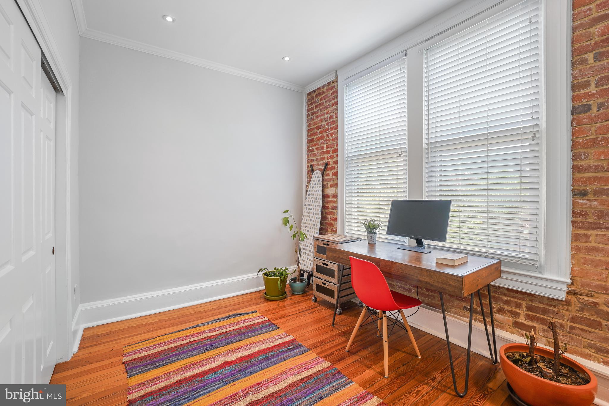 520 E Street Northeast, Unit 105 Washington, DC 20002 - Photo 22 of 30 a bedroom with a bed and a window
