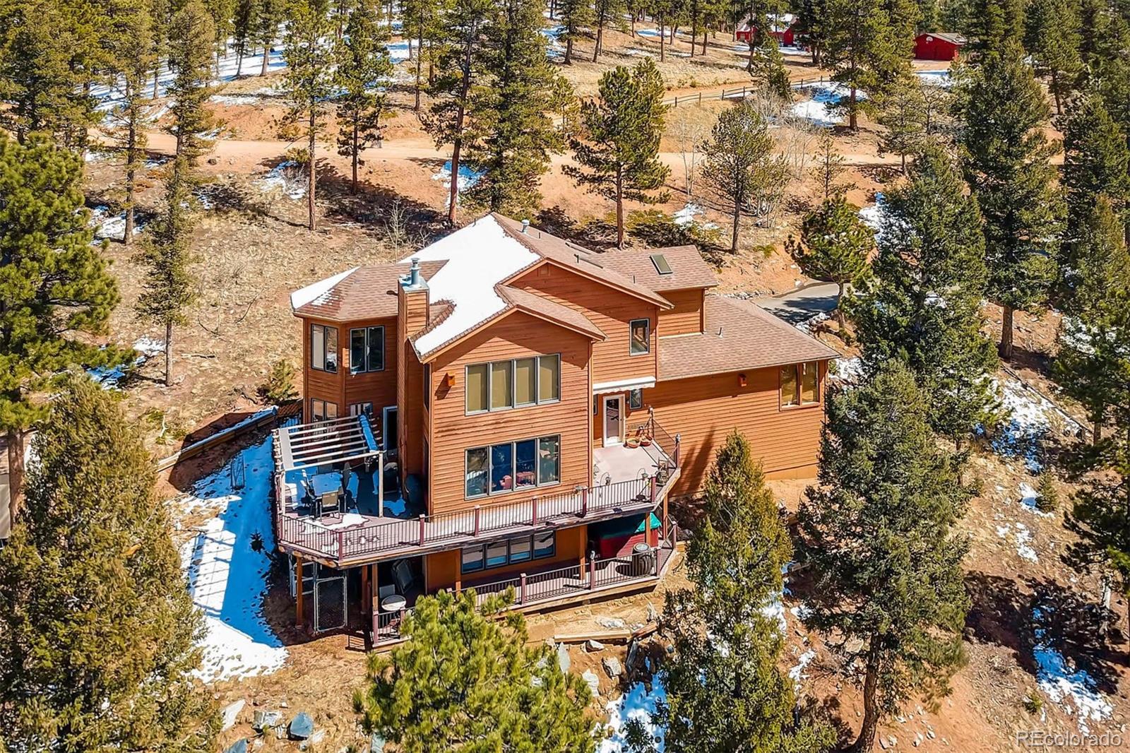 1081 Hitchrack Road Bailey, CO 80421 - Photo 1 of 35 an aerial view of a house with a yard