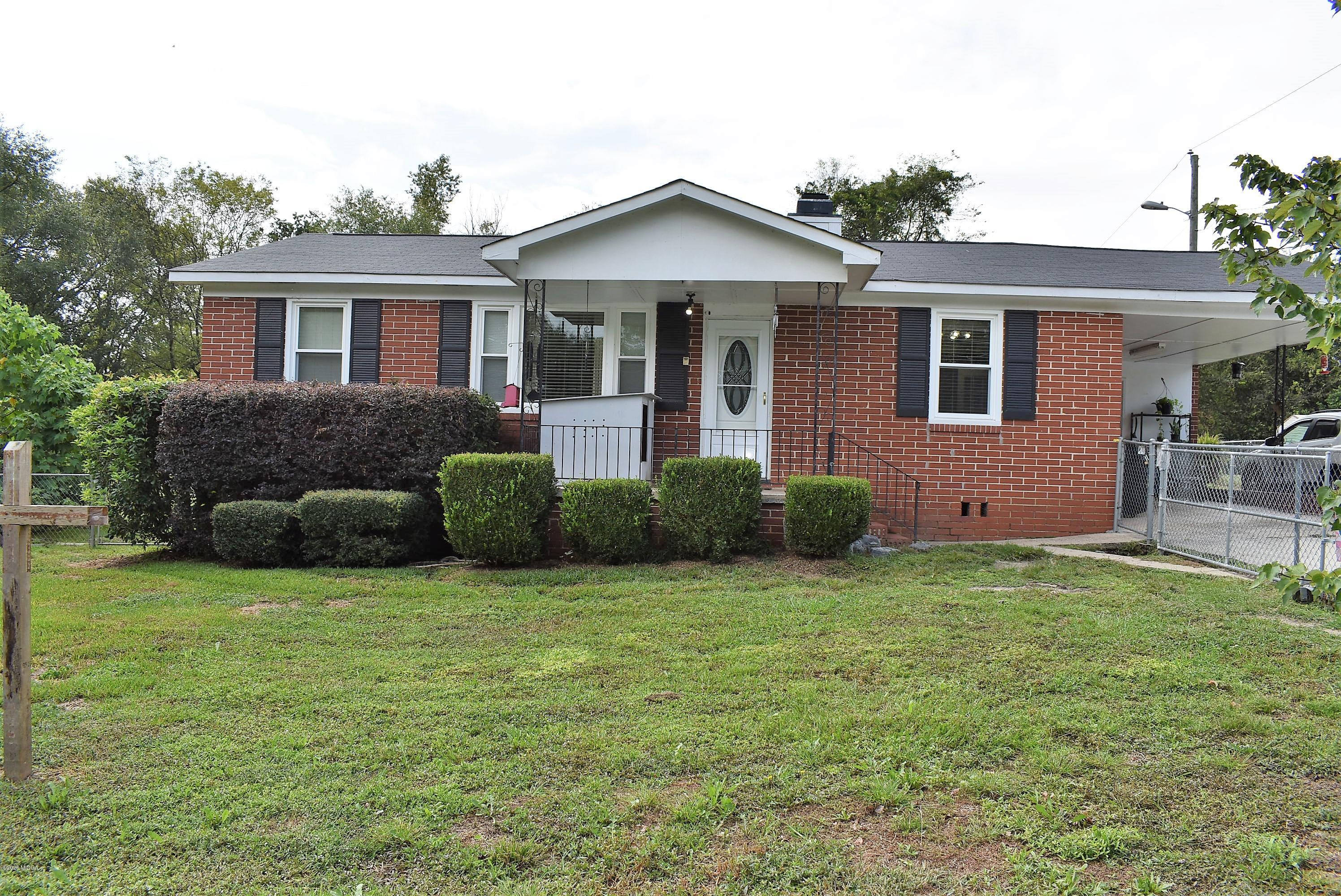 4825 Brookhaven Road Macon, GA 31206 - Photo 1 of 30 a view of a house with a yard and a garden