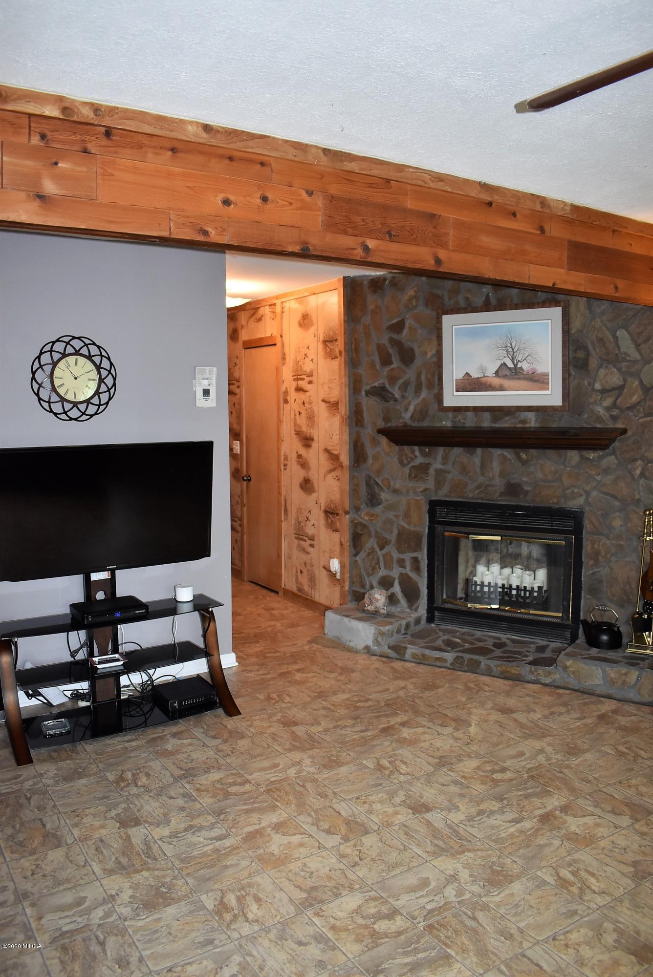 4825 Brookhaven Road Macon, GA 31206 - Photo 4 of 30 a living room with furniture and a fireplace