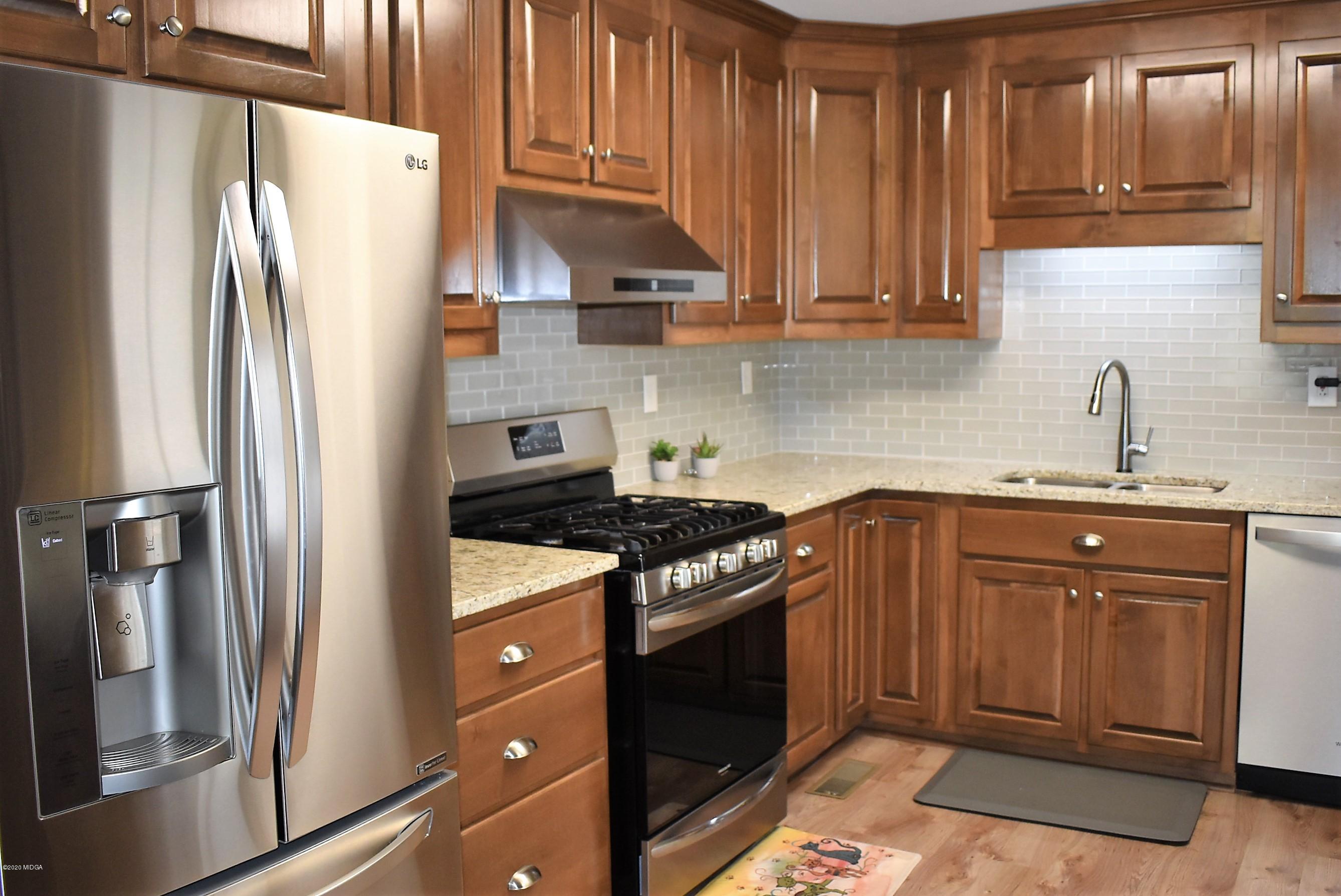 4825 Brookhaven Road Macon, GA 31206 - Photo 8 of 30 a kitchen with stainless steel appliances granite countertop a refrigerator sink and stove